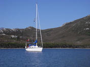 Photo of Club yacht Reflections at anchor in Hannant Inlet.